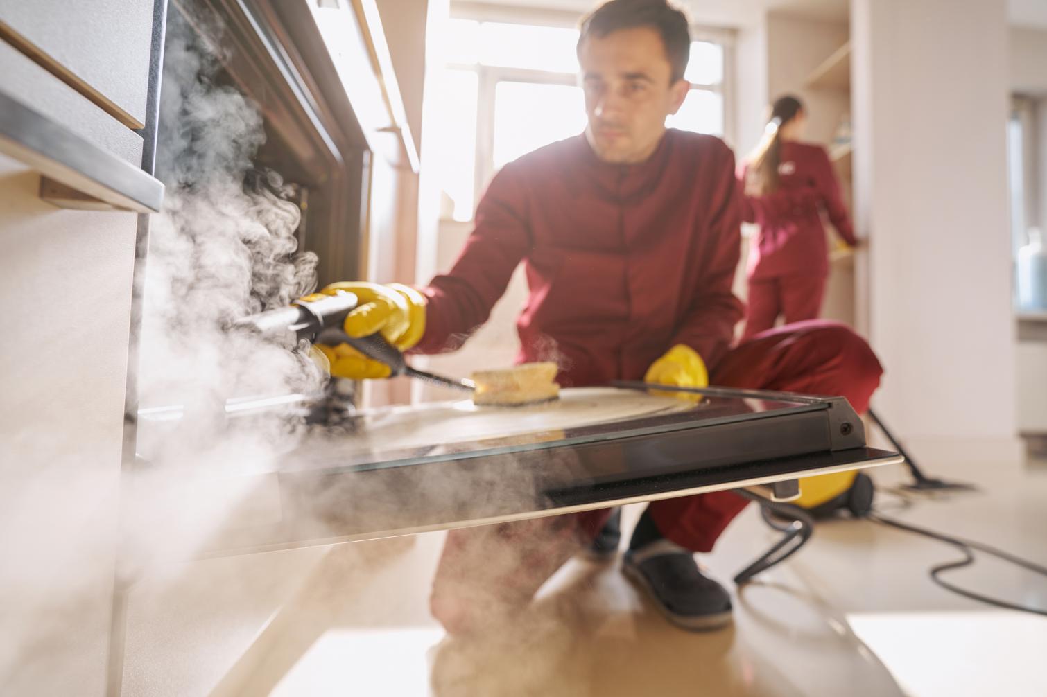 HiveLock pest control team performing steam treatment in kitchen